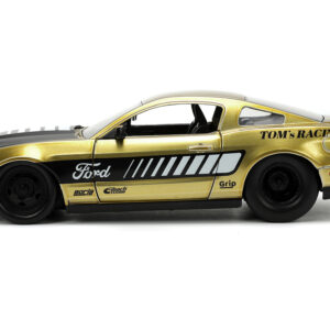 2010 Ford Mustang GT Gold Metallic with Black Graphics and Hood “Tom’s Racing” “Bigtime Muscle” Series 1/24 Diecast Model Car by Jada