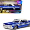 1964 Chevrolet Impala Lowrider Hard Top Candy Blue Metallic with Cream Top “Get Low” Series 1/24 Diecast Model Car by Motormax